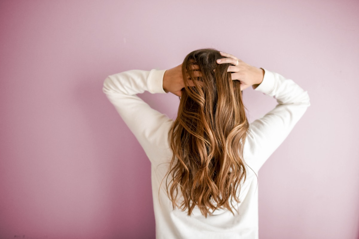 Close-up of hair colour application in a salon setting